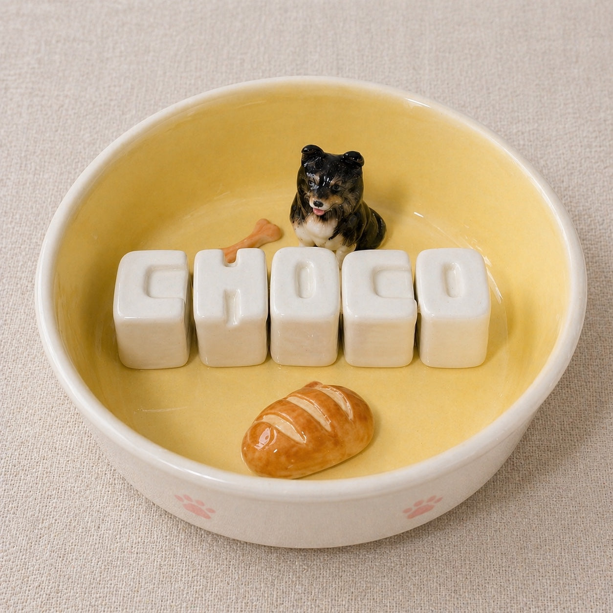 Product image of a custom name dog bowl with a personalized pet photo and ceramic feeding design.