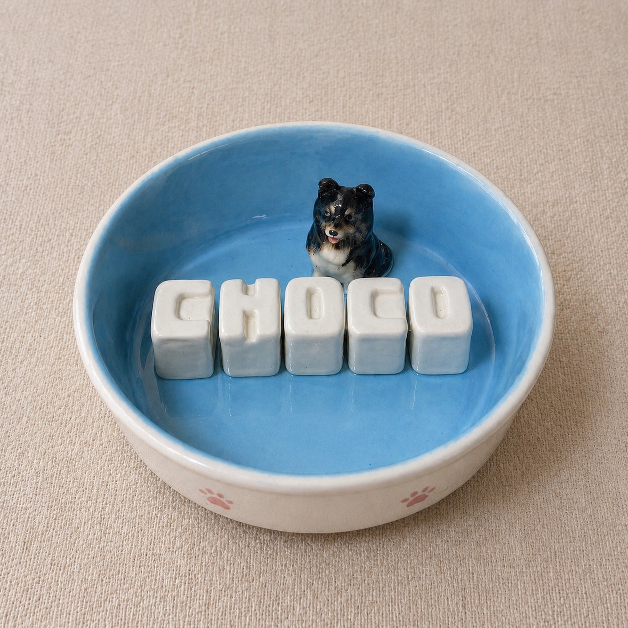 Product image of a custom name dog bowl with a personalized pet photo and ceramic feeding design.