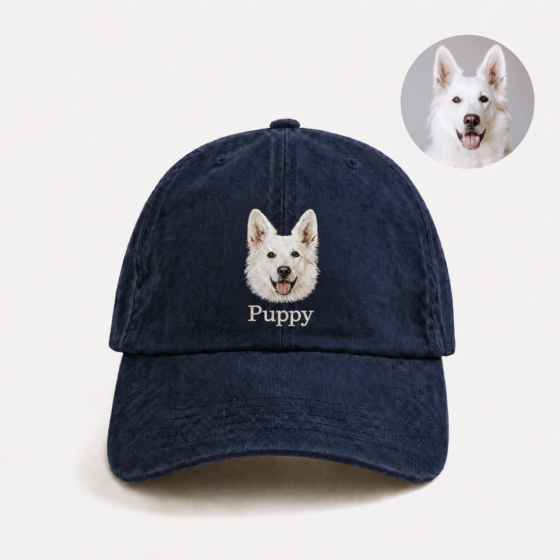 Custom pet portrait embroidered cap in navy with a white dog face and the personalized name Puppy.