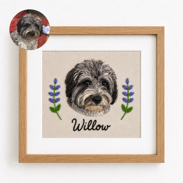 Product image of a square custom pet embroidery frame with a personalized pet portrait and name.