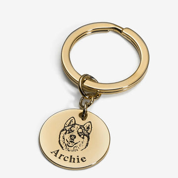 Engraved pet photo keychain in gold-tone stainless steel with a dog portrait and the name Archie.