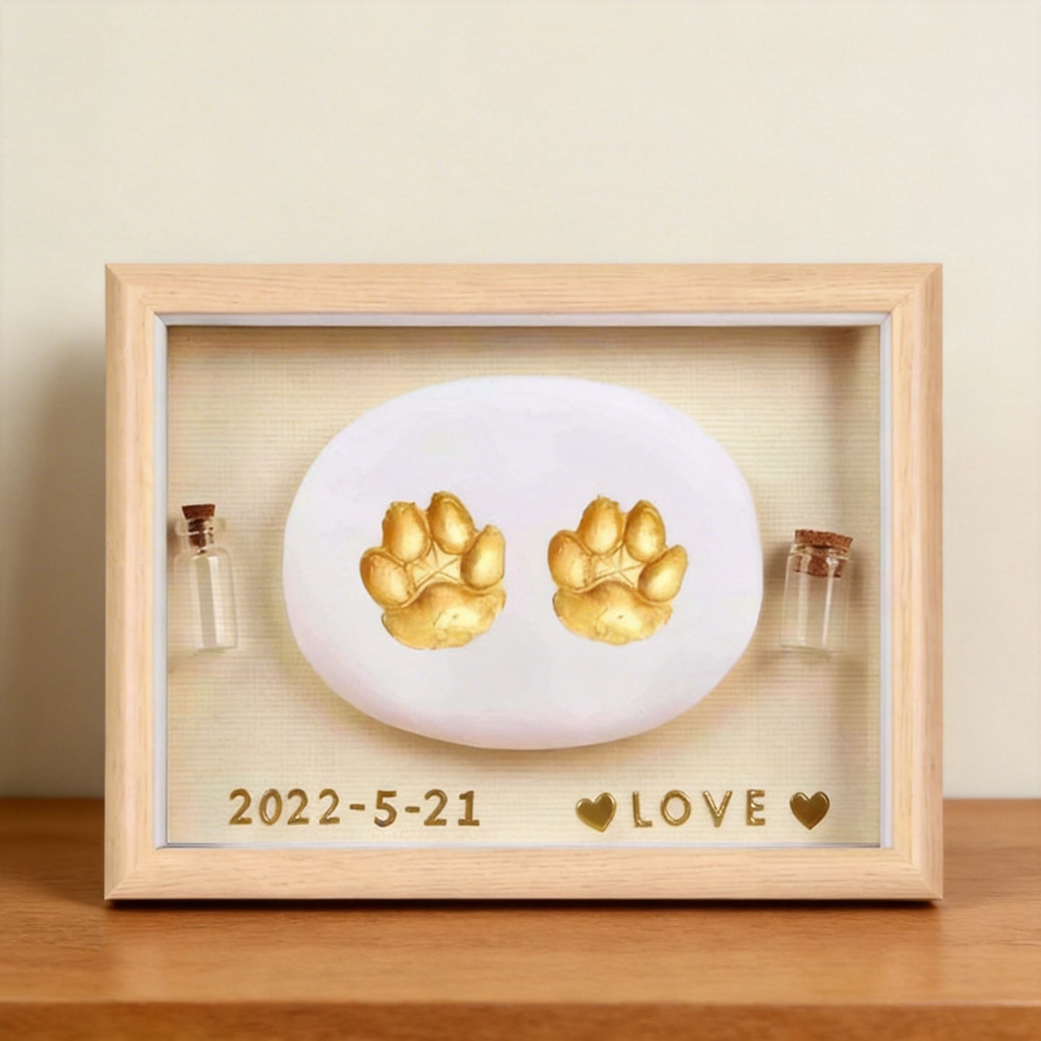 Product image of a personalized pet paw print frame for a dog's or cat's remembrance display.