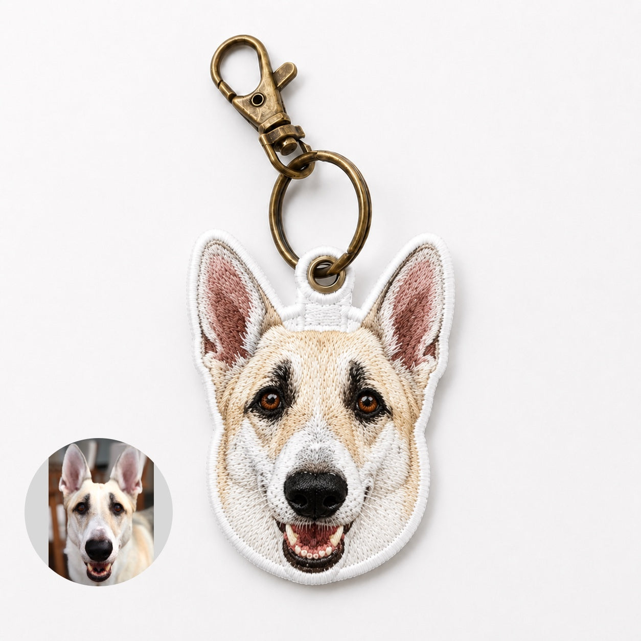 Product image of an embroidered pet portrait keychain with a tatami-style custom pet face.