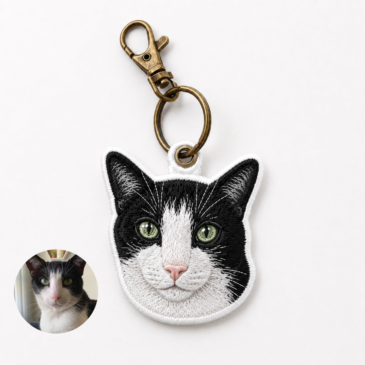 Product image of an embroidered pet portrait keychain with a tatami-style custom pet face.