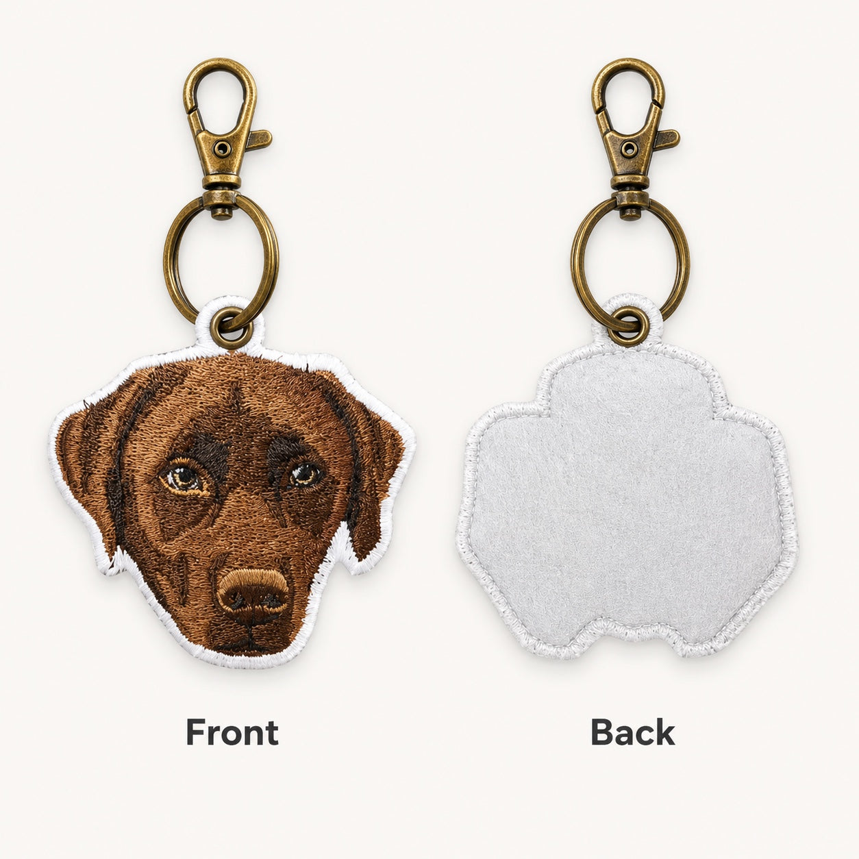 Product image of an embroidered pet portrait keychain with a tatami-style custom pet face.