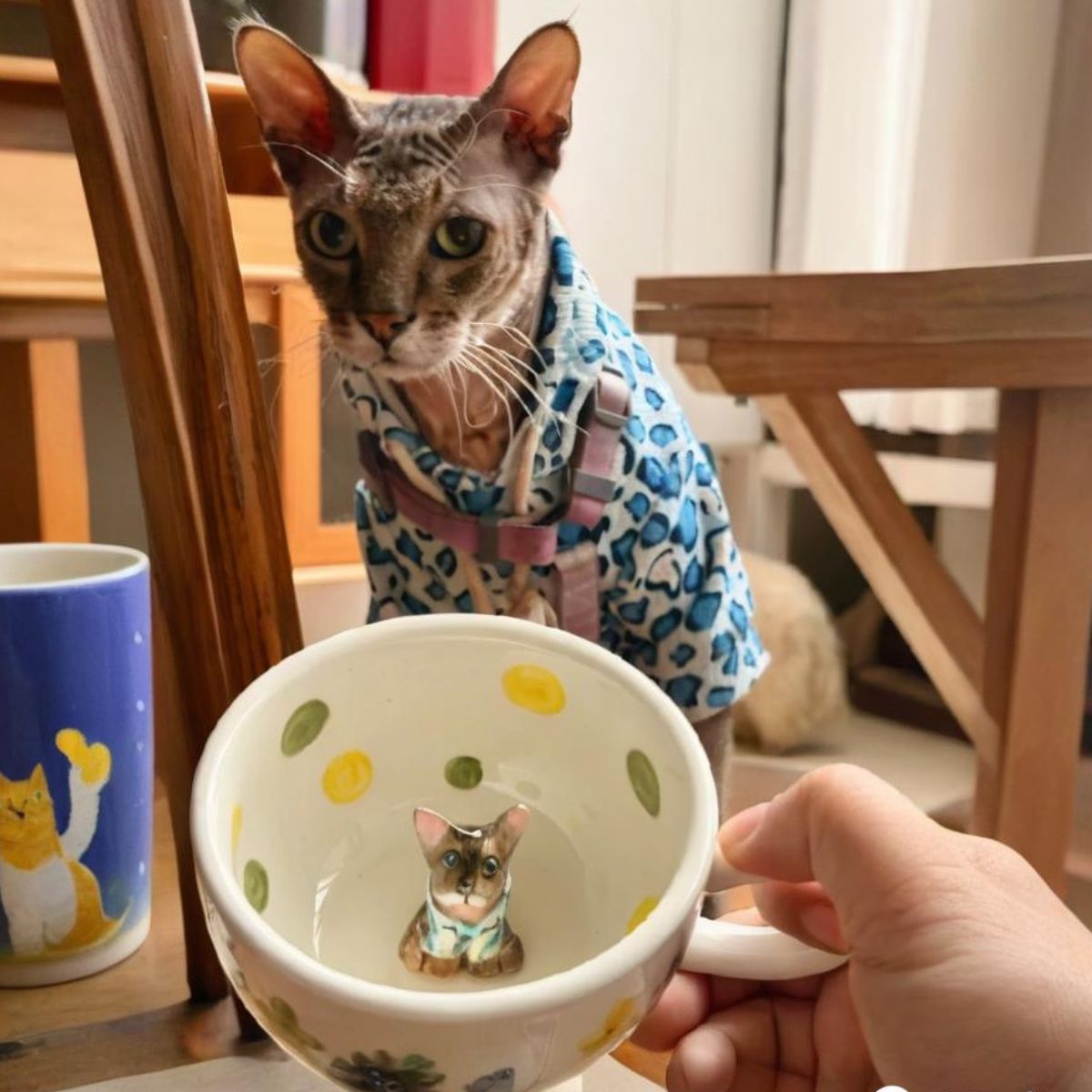 Product image of a 350 ml custom pet climbing mug with a handmade ceramic dog or cat figurine.