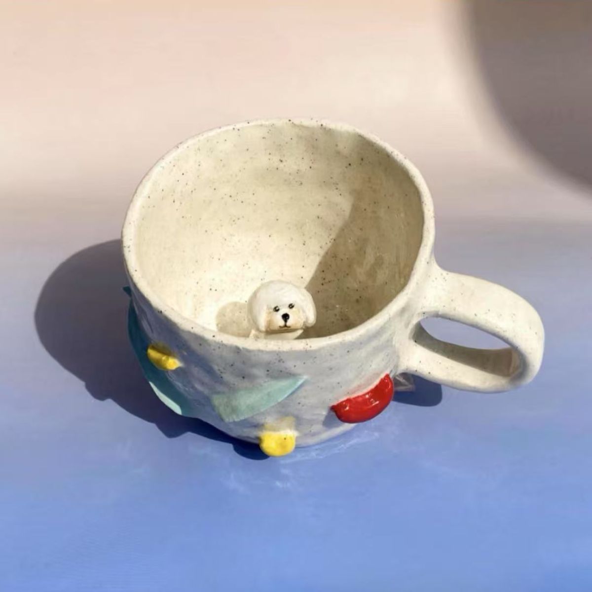 Product image of a 350 ml custom pet climbing mug with a handmade ceramic dog or cat figurine.