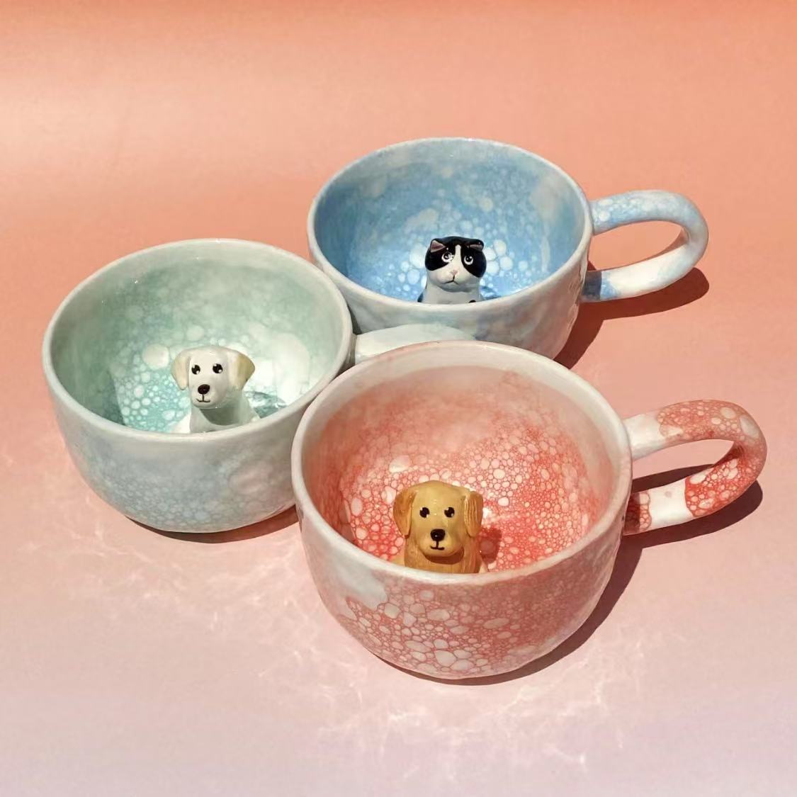 Product image of a 350 ml custom pet climbing mug with a handmade ceramic dog or cat figurine.