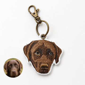 Product image of an embroidered pet portrait keychain with a tatami-style custom pet face.
