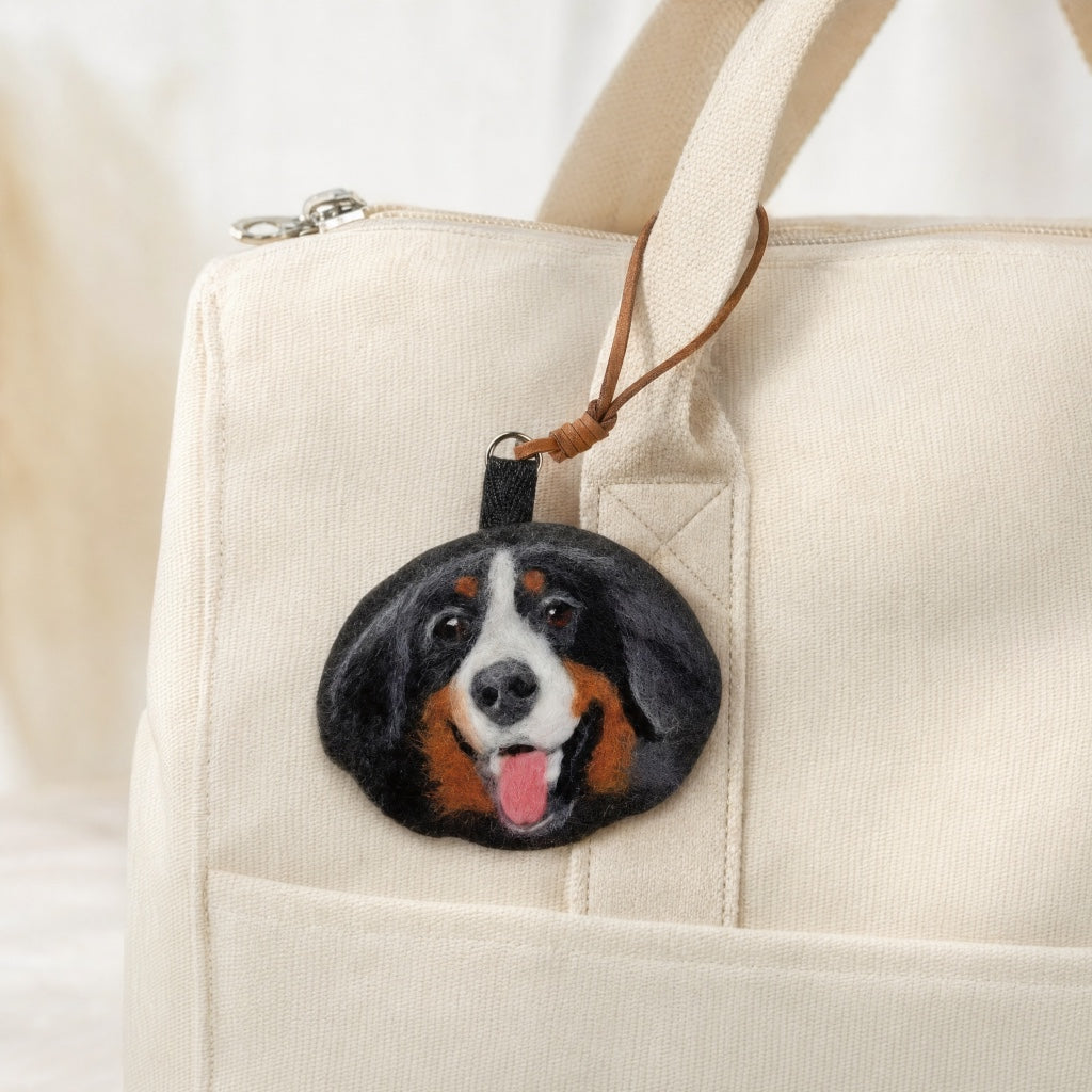 Product image of a needle felted pet keychain with a custom wool dog or cat portrait.
