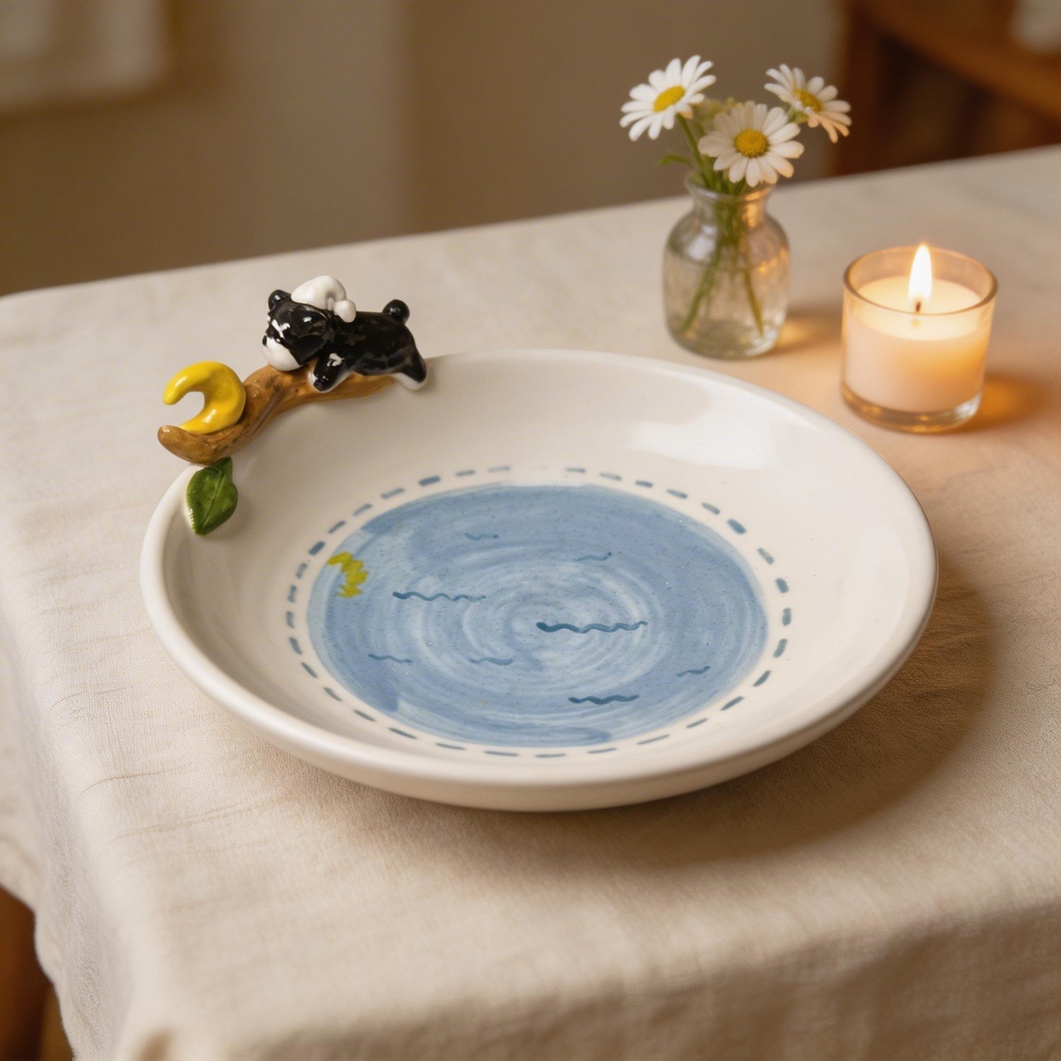 Close-up of the custom 3D pet figure on a personalized moon plate.