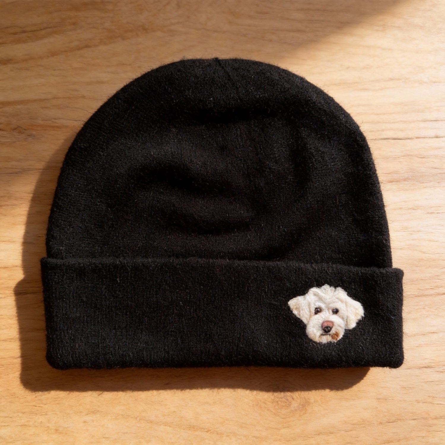 Custom wool beanie with a pet portrait worn as a personalized accessory.