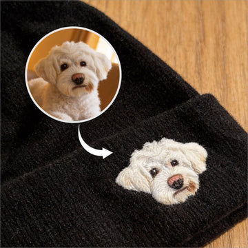 Front view of a wool beanie with a hand-felted custom pet portrait.