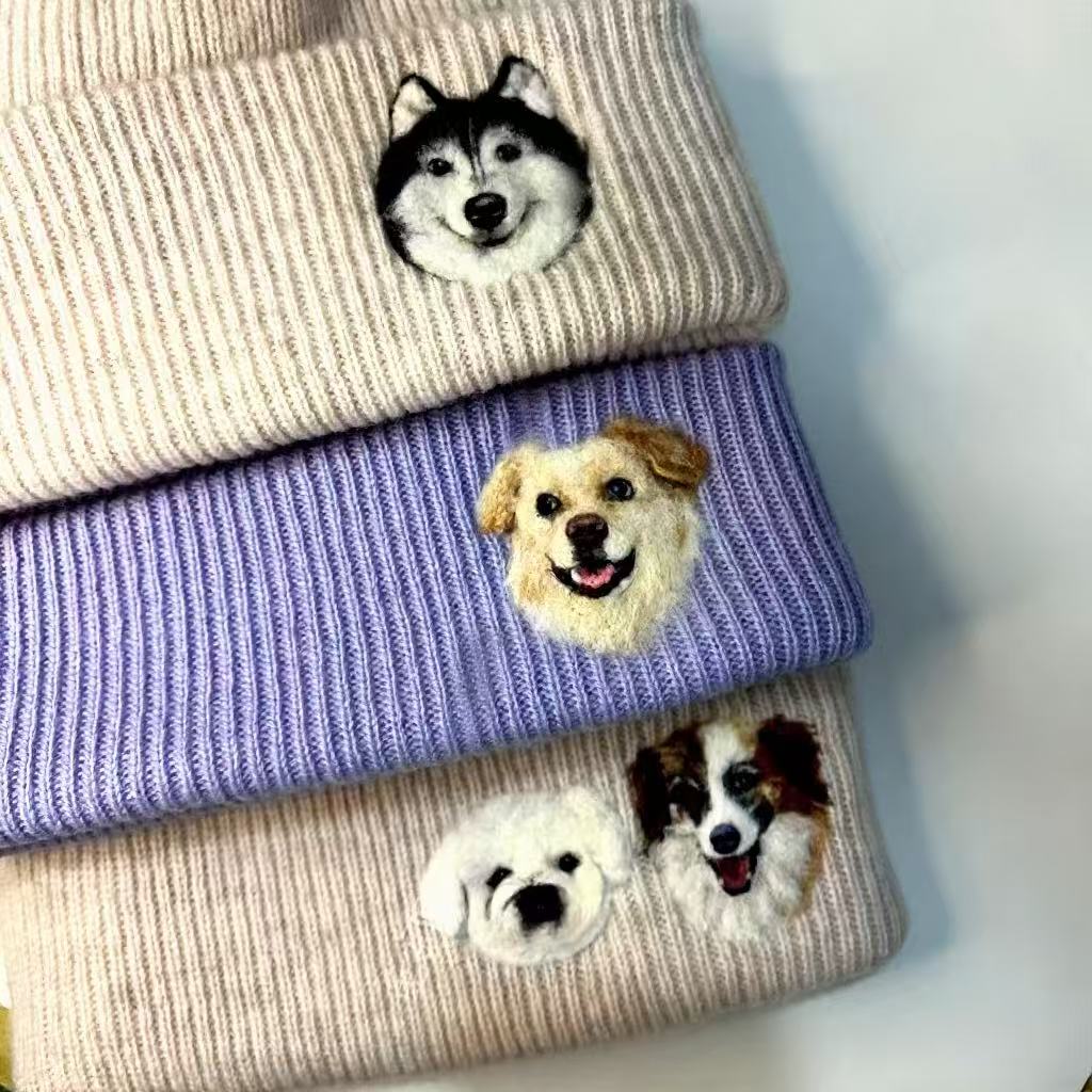 Close-up detail view of custom pet portrait hand-felted wool beanie hat highlighting the personalized finish.