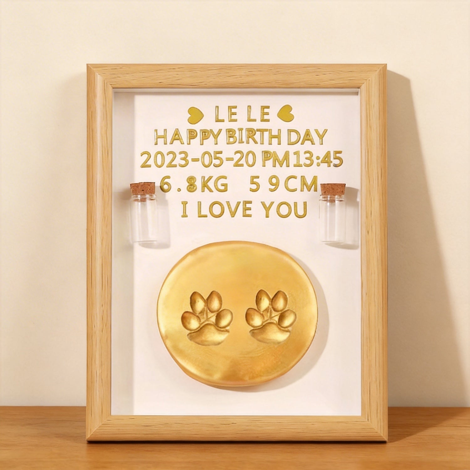 Product image of a personalized pet paw print frame for a dog's or cat's remembrance display.