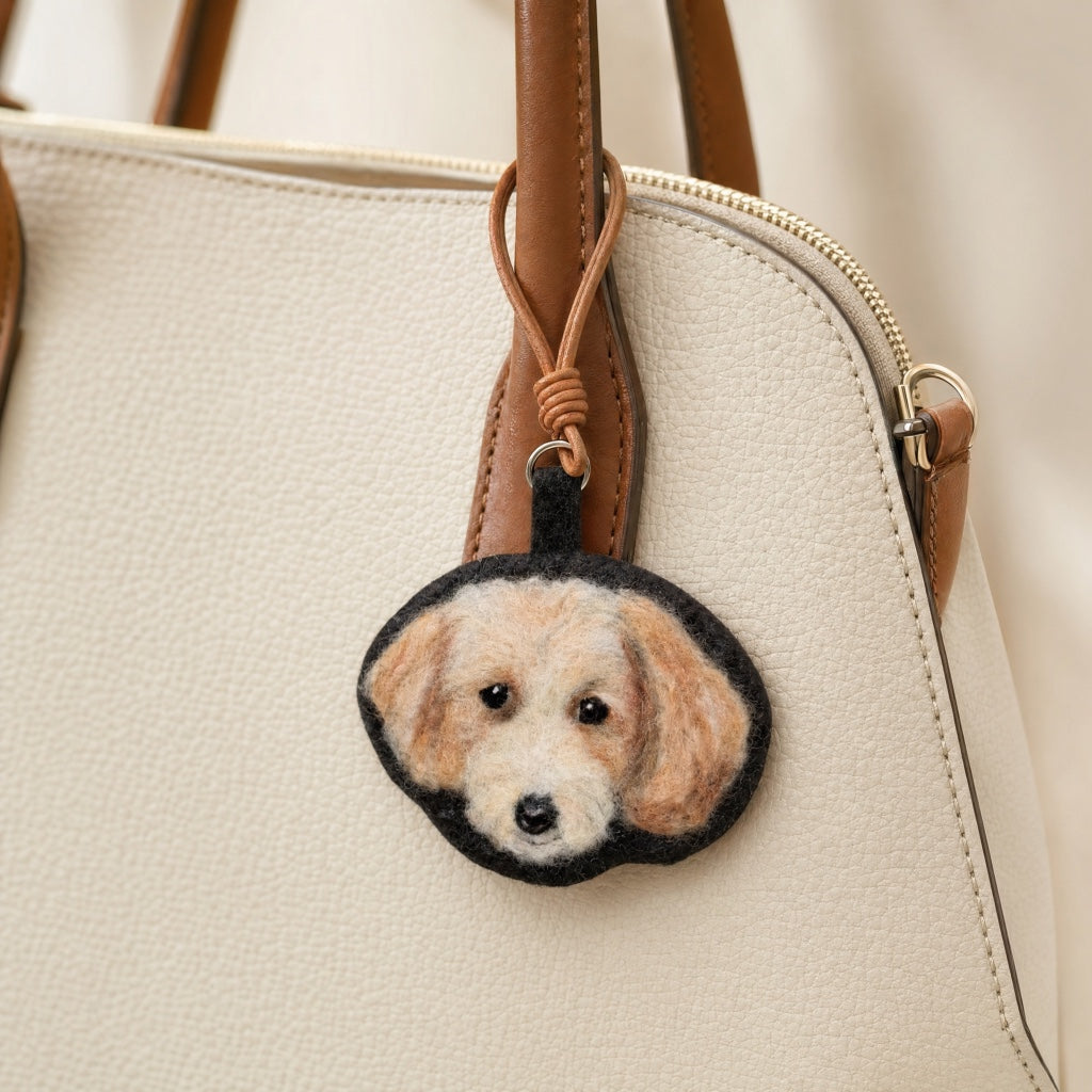 Product image of a needle felted pet keychain with a custom wool dog or cat portrait.