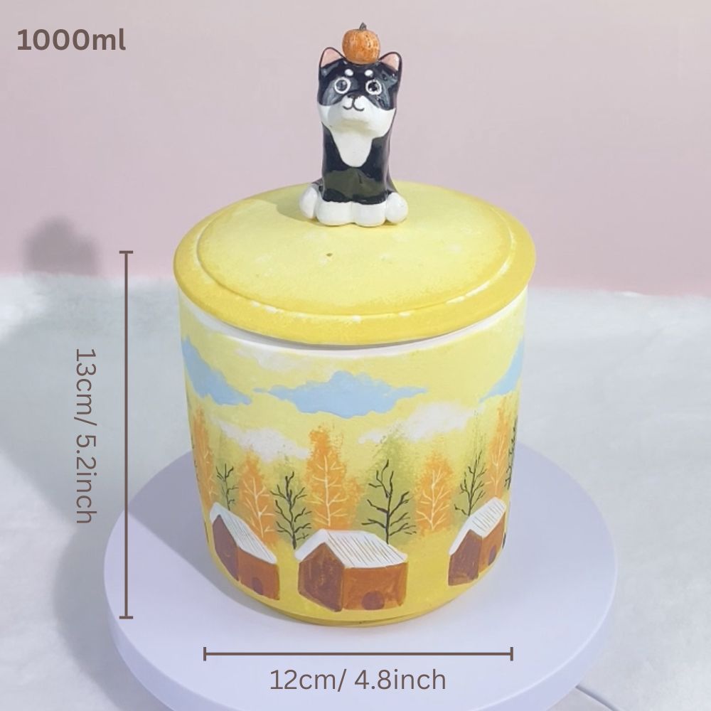 Close-up detail view of handmade ceramic pet urn for ashes with 3d figurine lid highlighting the personalized finish.