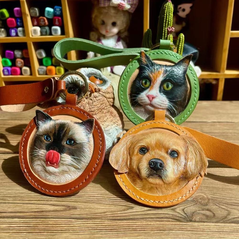 Front view of a handmade round leather keychain with a custom pet portrait.