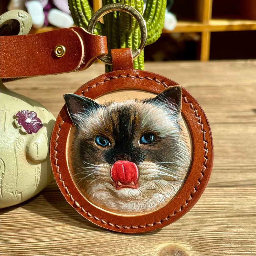 Close-up detail view of handmade leather pet portrait keychain with engraving option highlighting the personalized finish.