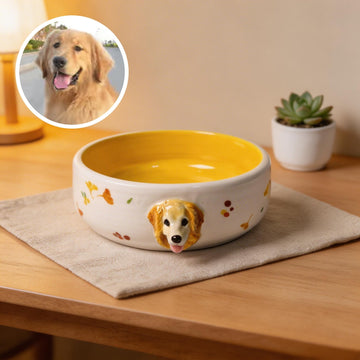 Front view of a ceramic pet bowl with a raised custom 3D pet head on the rim.